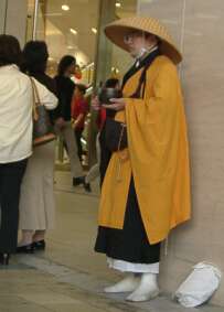 Buddhist monk with begging bowl